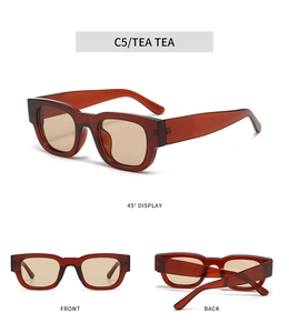 Dettaglio di occhiali da sole quadrati vintage color tè con stanghette spesse e lenti