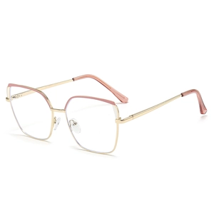 Pink and gold oversized cat-eye metal glasses frame with color-blocking accents