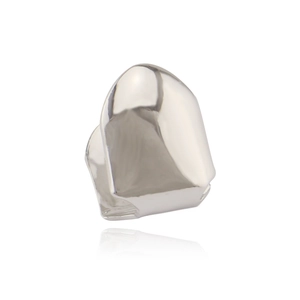 Macro shot of polished silver single tooth grillz with reflective surface on white background