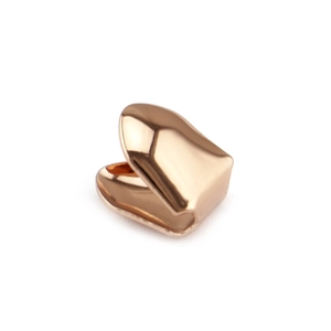 Macro shot of 18K rose gold plated vampire fang dental grillz with hip-hop U-shaped design