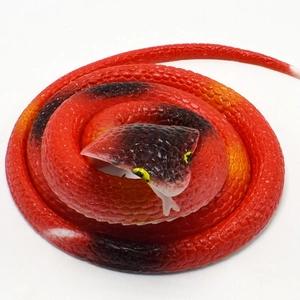 Detailed top view of realistic red and black cobra toy with textured rubber scales