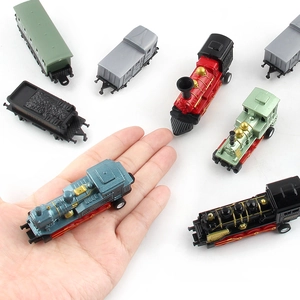 Miniature vintage steam train alloy toy car set shown in hand for size scale