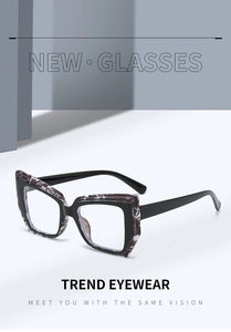 Detail of trendy two-tone cat-eye glasses frame with marble pattern and blue light lenses