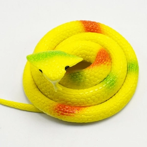 Detailed macro view of realistic TPR cobra toy with yellow body and orange scale textures