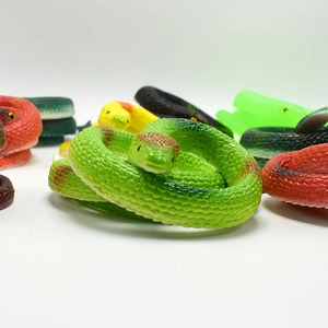 Macro detail of soft TPR rubber toy snakes showing realistic scale texture and varied colors