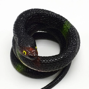 Detailed macro view of a realistic coiled TPR rubber snake with black body and red head details