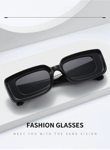 Detail of trendy rectangle black sunglasses with thick frames on white geometric stand