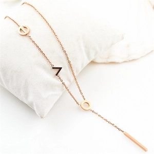 Elegant rose gold stainless steel necklace featuring LOVE letters on a jewelry pillow