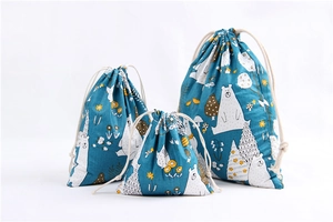Three-piece set of blue cotton linen drawstring bags with arctic bear forest patterns