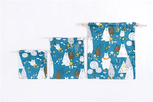 Three sizes of blue drawstring storage bags with polar bear and owl cartoon prints