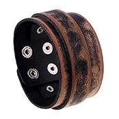 Close-up of vintage wide leather bracelet with metal buckles in black and brown