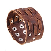 Close-up of vintage brown leather wide cuff bracelet with metallic studs and buckles