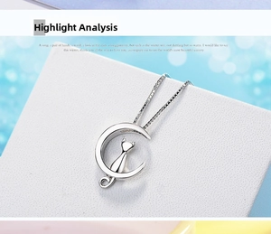 Detailed close-up of a silver crescent moon pendant featuring a sitting cat silhouette
