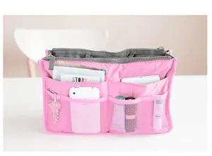 Pink multi-pocket purse organizer insert showing mesh storage for phone and cosmetics