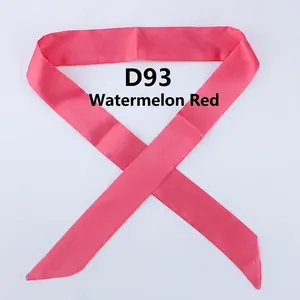 Detailed view of the watermelon red satin scarf featuring a narrow design and diagonal ends