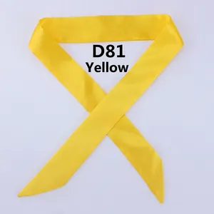 Detailed close-up of smooth yellow satin skinny scarf for handbags and neck accessories