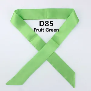 Detailed view of long lime green satin skinny scarf with a smooth lustrous finish