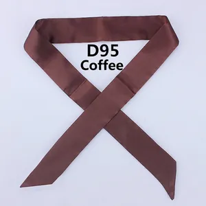 Detailed view of coffee brown satin silk skinny scarf with diagonal cut ends and smooth texture