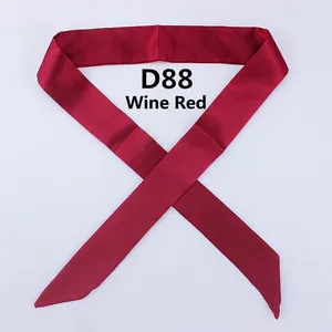 Detail of wine red narrow silk scarf D88 with smooth satin texture and pointed ends