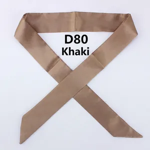 Detail shot of khaki silk narrow scarf with pointed ends for bag handle decoration