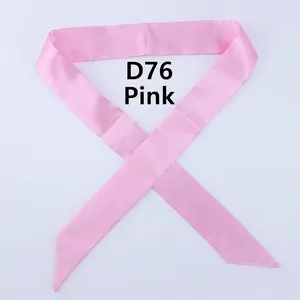 Flat lay of pink silk-like satin skinny scarf with diagonal cut ends for handbags
