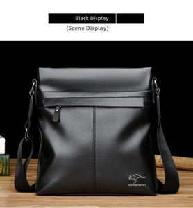 Close-up of black textured leather messenger bag featuring silver kangaroo logo detail