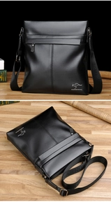 Detailed view of black leather shoulder bag with zipper pocket and silver logo detail