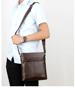 Brown leather crossbody bag for men showing adjustable strap and brand logo detail