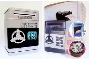 Detail of grey ATM piggy bank featuring a keypad, rotating handle and retail packaging