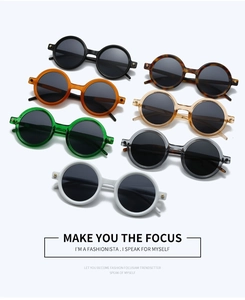 Close-up of retro round sunglasses collection featuring thick frames and metal rivet detail