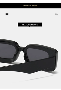 Detail view showing the high-gloss texture of the black rectangular sunglasses frame