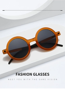 Retro round matte amber sunglasses for kids displayed on white geometric minimalist steps