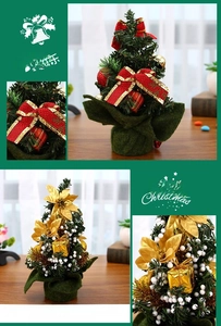 Detail of mini desktop Christmas trees with red ribbons, gold bells, and festive ornaments