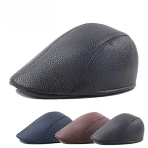 Detailed close-up of textured leather beret cap showing black and blue color variants