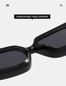 Close-up of integrated comfortable nose support on polished black square sunglasses