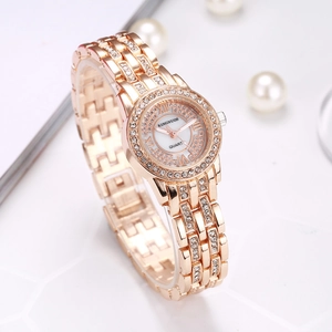 Macro detail of elegant rose gold lady watch with rhinestones and Roman numerals
