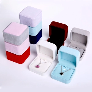 Macro view of assorted velvet necklace gift boxes with soft lining and jewelry slots