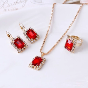 Detailed view of red gemstone jewelry set including necklace, earrings and ring
