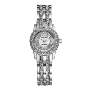 KINGNUOS luxury silver women's watch featuring rhinestone bezel and mother-of-pearl dial