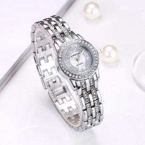 Elegant silver women's watch with rhinestone bezel and Roman numeral shell dial