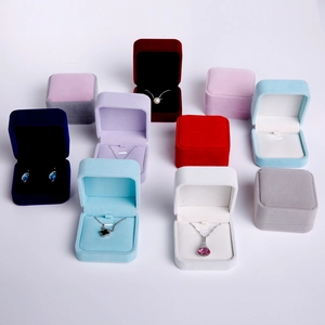 Detailed grid of colorful velvet jewelry boxes for necklaces and earrings in various colors