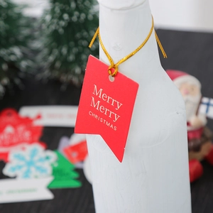 Red flag-shaped Christmas gift tags with gold Merry Christmas print and gold string