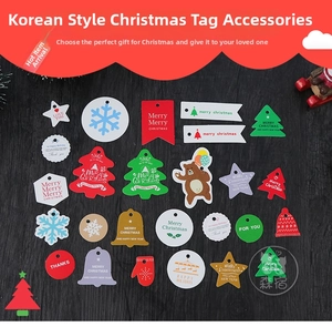 Close-up of colorful Christmas gift tags with festive shapes and holiday greetings