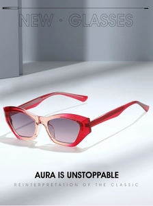Detail of red gradient geometric cat-eye sunglasses with transparent frame texture