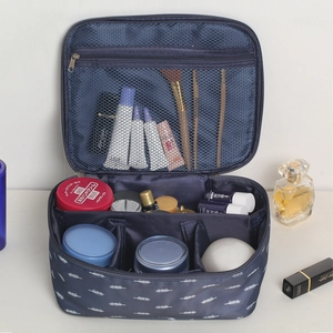 Large capacity navy blue travel makeup bag with leaf print and internal dividers