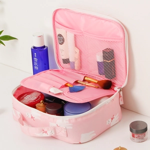 Pink travel cosmetic bag with cat pattern showing interior mesh pockets and compartments