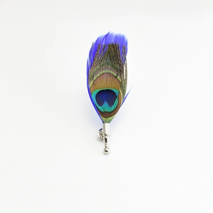 Elegant peacock feather brooch with blue tinted accents and silver metal base for suits