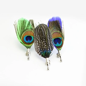 Elegant peacock and guinea fowl feather lapel pins for suits in green, blue, and black