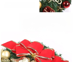 Close-up of Christmas wreath with red gold ribbons and decorative pine needles