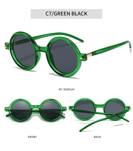 Detail view of vintage round sunglasses in emerald green finish and gray lenses